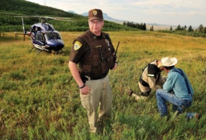 Checking out a rancher after a search mission. With Two Bear lending a helping hand, local law enforcement agencies now have the air support they once could have only dreamed of.